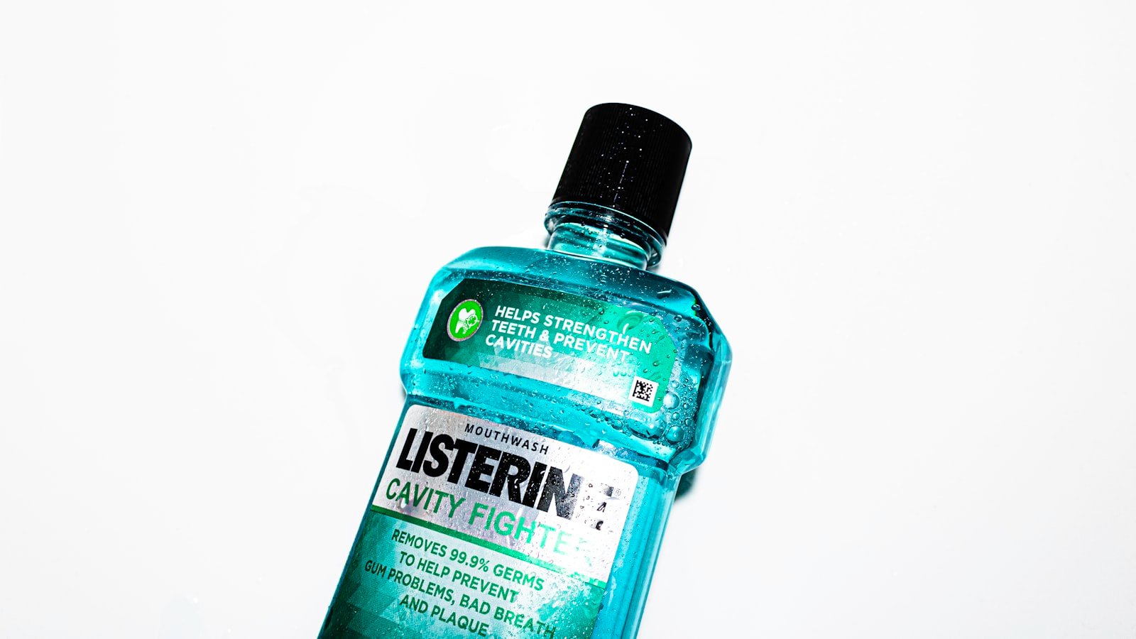 Bottles of mouthwash on bathroom shelf